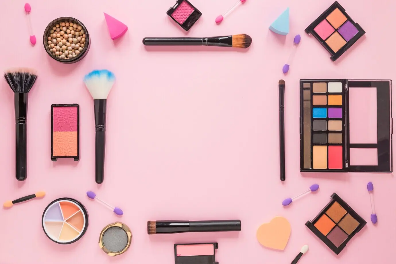 Eyeshadows with powder brushes on a table