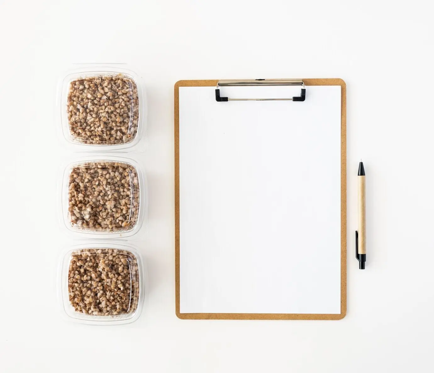 Overhead view of a notepad and food rations intended for donation.